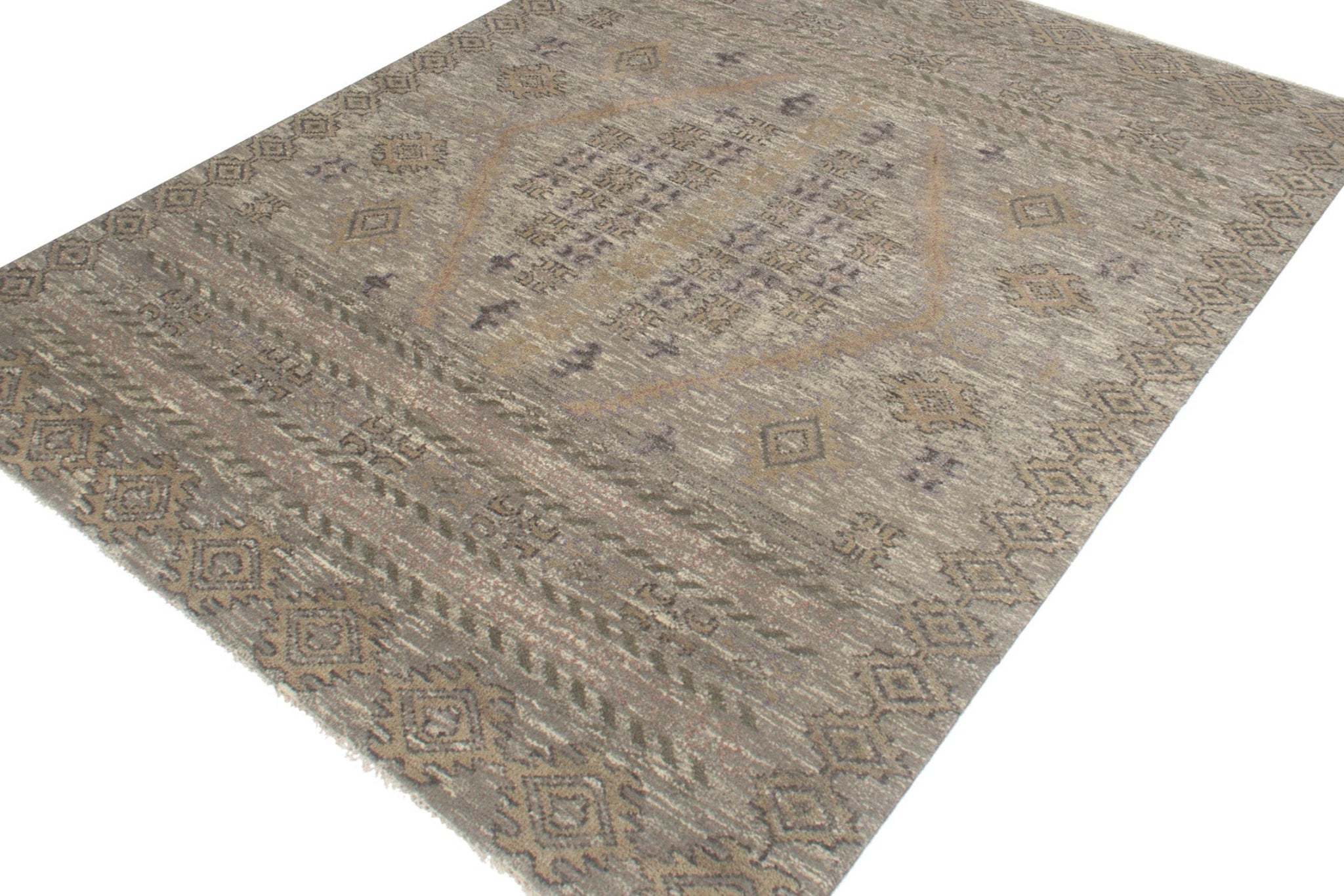 Handwoven tribal rug in muted earth tones, featuring an intricate geometric pattern.
